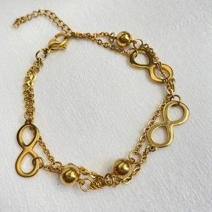 Gold Tone Double Stranded Bracelet Ball And Infinity Charms